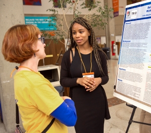 Student and faculty at a poster presentation