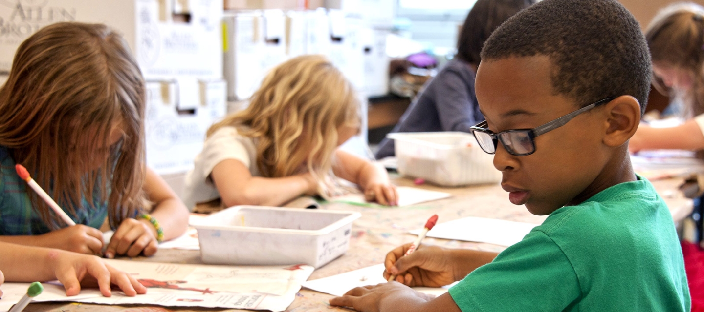 Children studying at a table