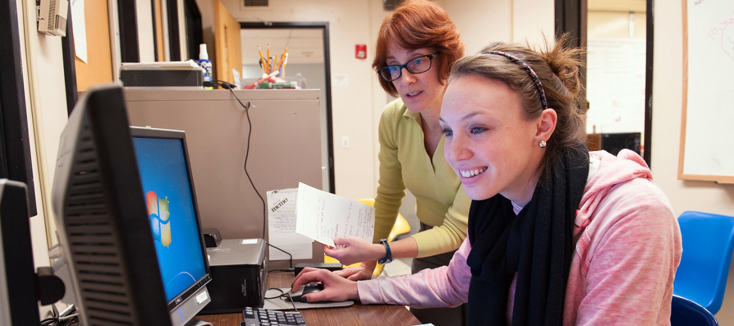 Student and faculty member working on a project